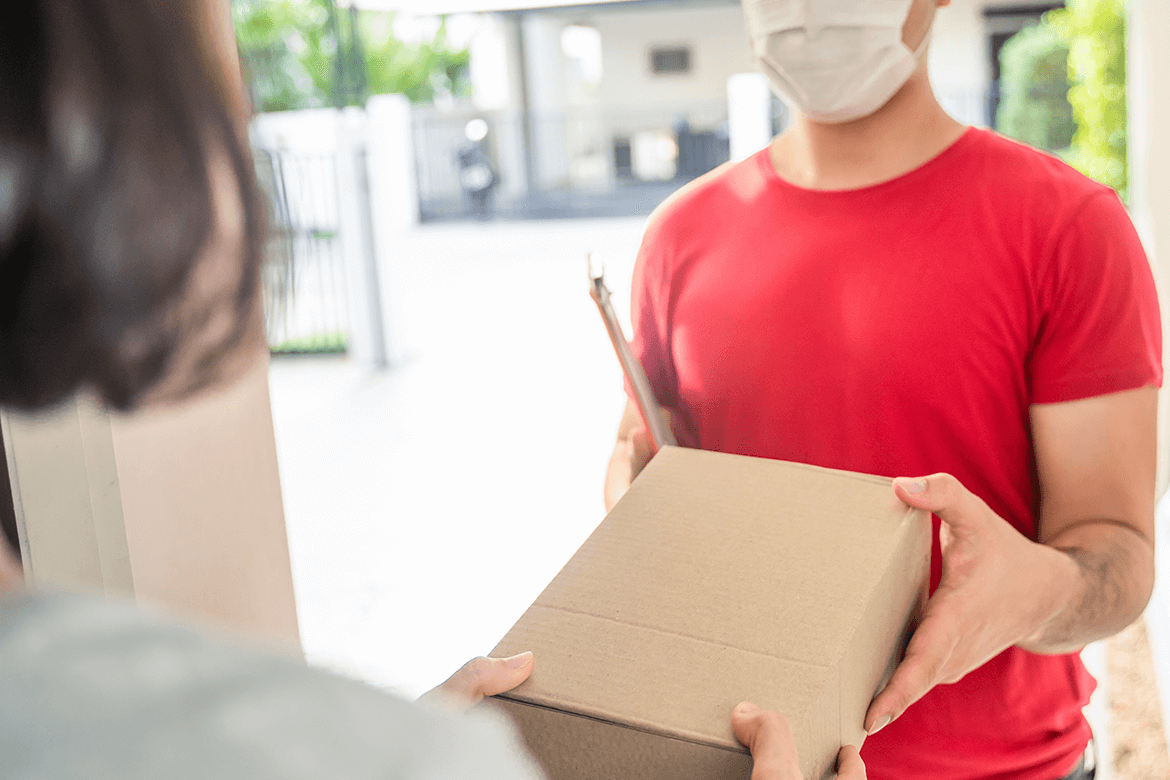 Man delivery package to front door