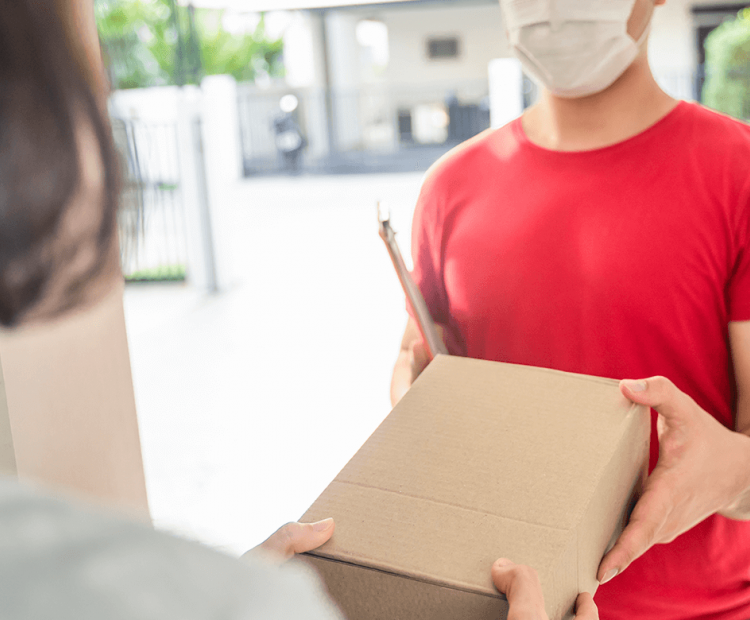 Man delivery package to front door