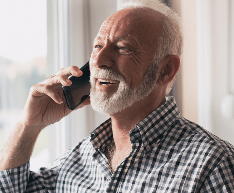 Senior man speaking on a cell phone