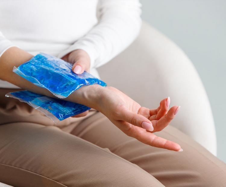 Woman with ice pack on wrist