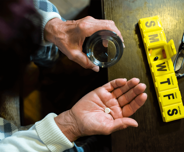 Woman taking daily medication