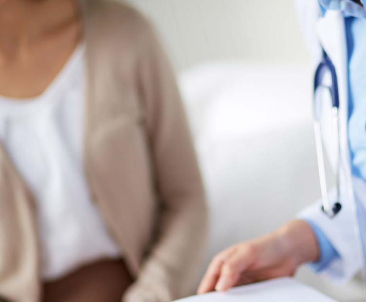 Woman speaking with doctor