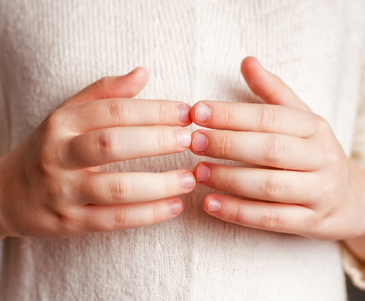 Woman touching her fingers together