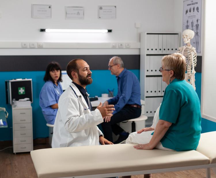 Patient discussing recovery with doctor. 