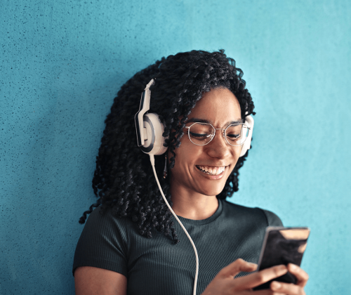 Happy woman listening to music