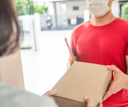 Man delivery package to front door