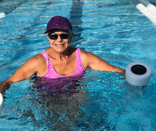 Senior woman exercising in pool