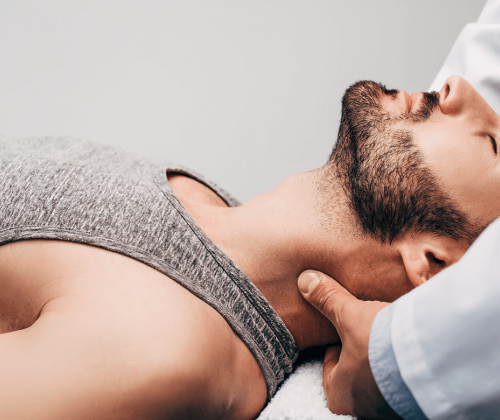 Man getting neck adjustment from chiropractor