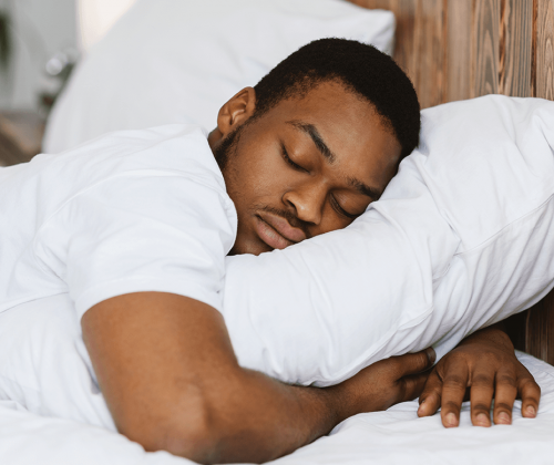 Man sleeping and using a pillow