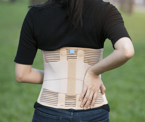 Woman wearing a back brace