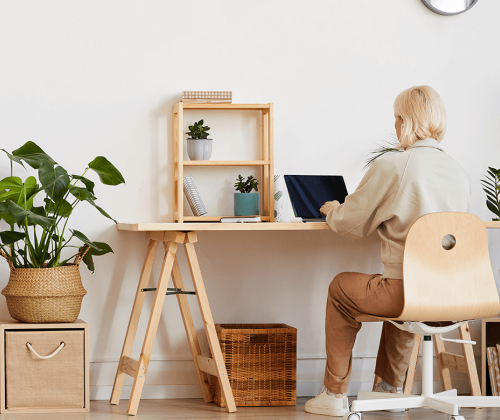 Woman sitting at home office desk