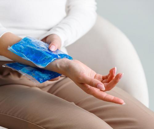 Woman with ice pack on wrist