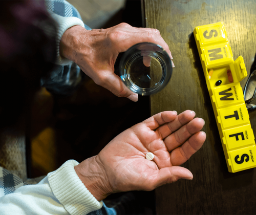 Woman taking daily medication
