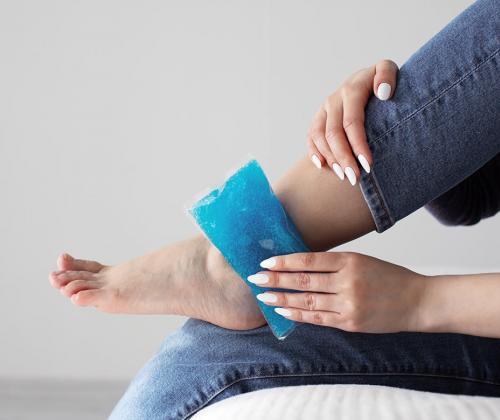 Woman icing ankle