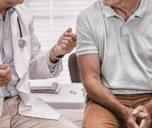 Man sitting with doctor