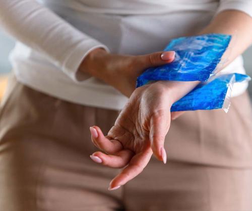 Woman with ice pack on her wrist