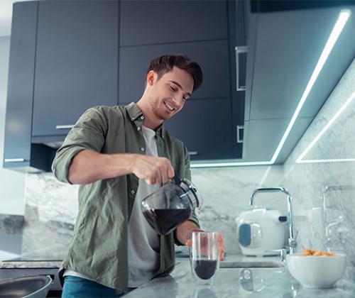 Man pouring cup of coffee