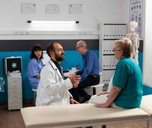 Patient discussing recovery with doctor. 