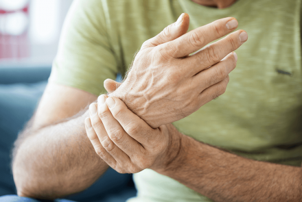 Man holding wrist in pain