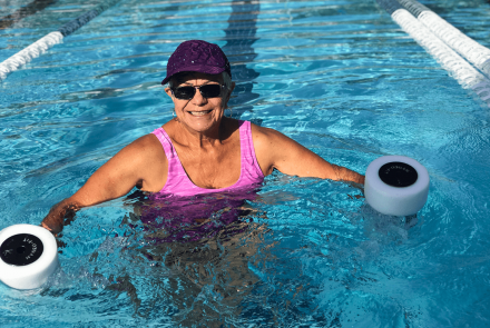 Senior woman exercising in pool