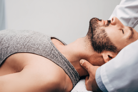 Man getting neck adjustment from chiropractor