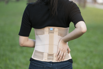 Woman wearing a back brace