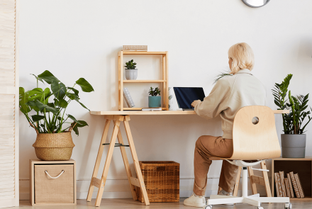Woman sitting at home office desk