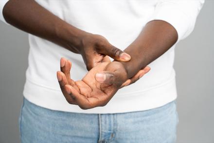 Man holding wrist in pain