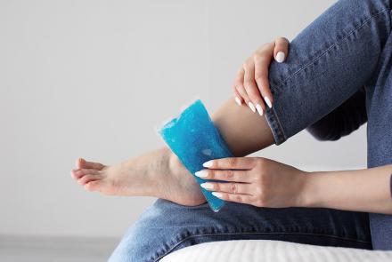 Woman icing ankle