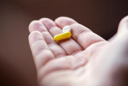 Hand holding pills