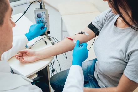 Woman receiving EMG nerve test on her arm