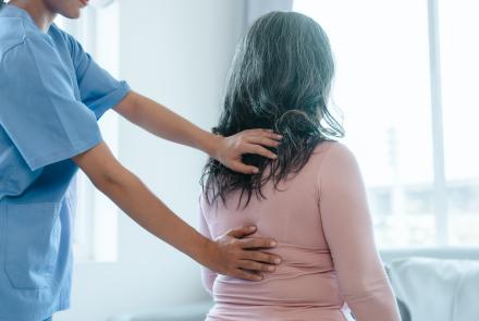 Woman having her back examined.
